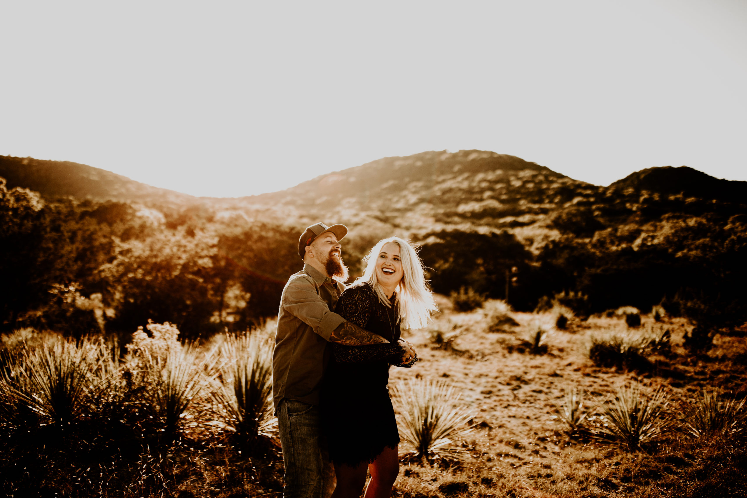 engagement photo shoot in the Texas desert hills in background